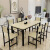 二番のテーブルとテーブルセットのシンプロテーブル長方形家庭用テーブルレストランのテーブル4人/6人の柚木色面に黒い棚110*60テーブルに椅子4つを配置します。