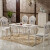宝雅蒂斯洋風大理石テーブルセット純木彫刻模様象牙白漆1.3 m木のテーブルに四つの椅子があります。