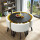 黒大理石の円卓を模した黄色の白革の椅子一つのテーブル