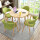 原木色のテーブルの緑の布椅子